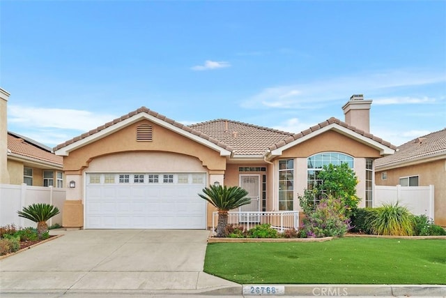 view of front facade with a front lawn and a garage