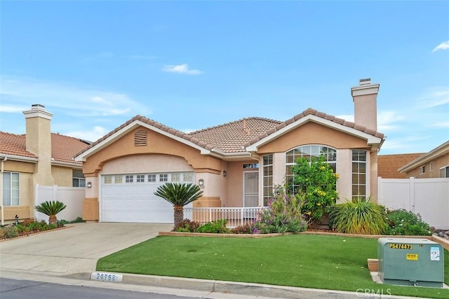 view of front of home featuring a front lawn and a garage