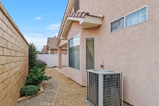 view of property exterior featuring central AC