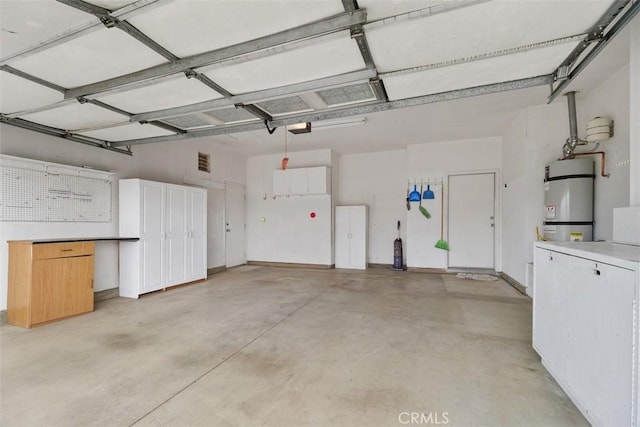 garage with secured water heater and a garage door opener