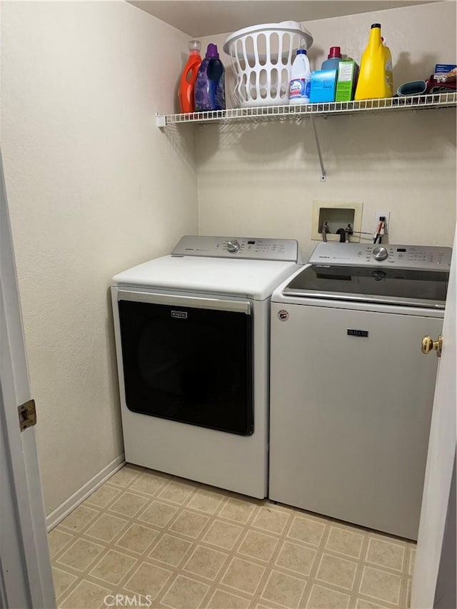 washroom featuring washing machine and dryer