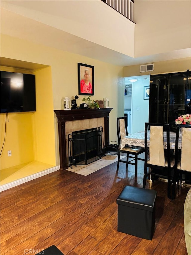 living room featuring a fireplace and hardwood / wood-style floors