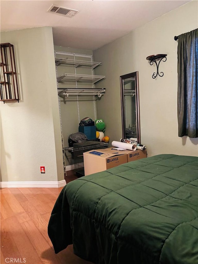 bedroom with hardwood / wood-style flooring