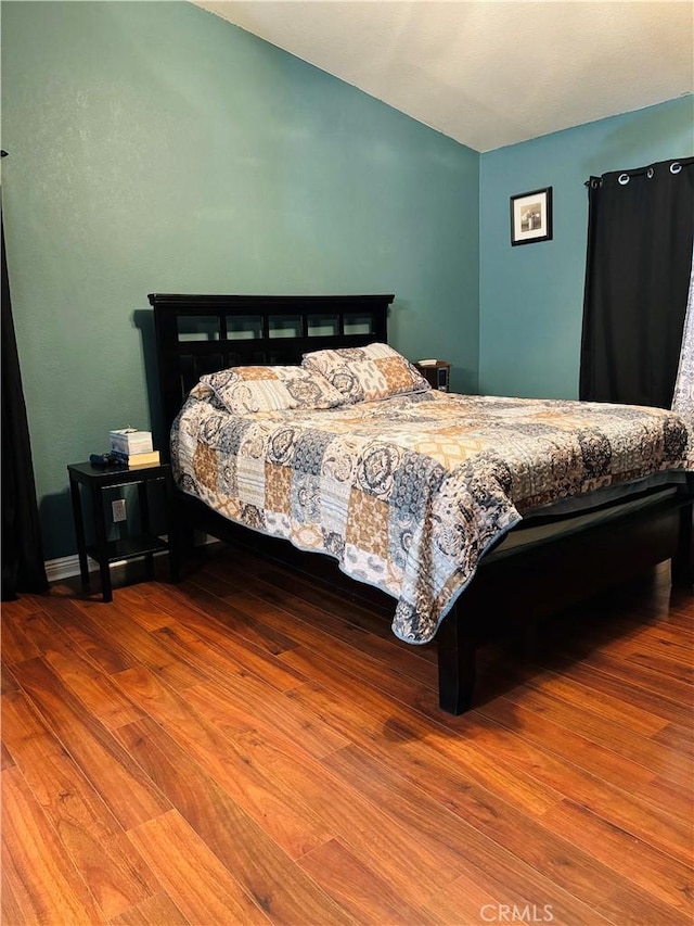 bedroom featuring hardwood / wood-style flooring