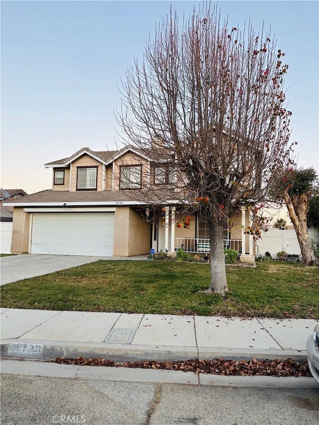 view of front facade featuring a yard and a garage