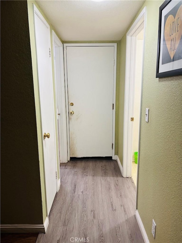 hallway featuring light hardwood / wood-style floors