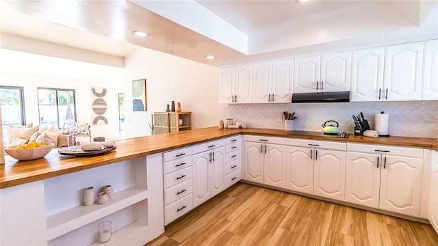 kitchen with white cabinetry, light hardwood / wood-style flooring, and wood counters