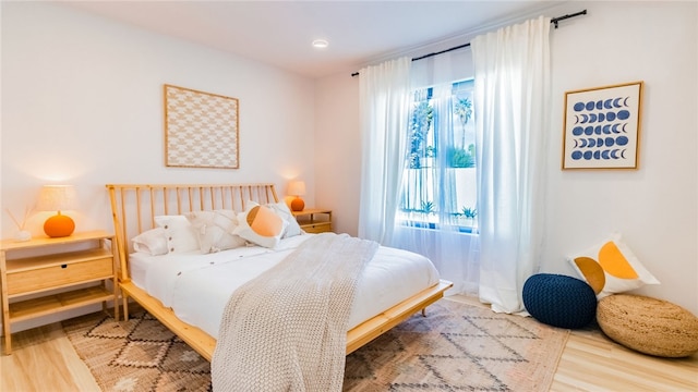 bedroom featuring hardwood / wood-style floors