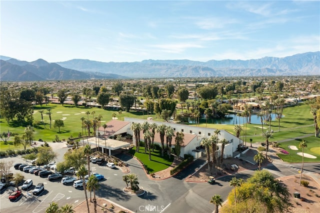 birds eye view of property featuring a water and mountain view