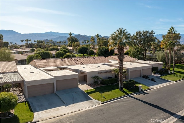 birds eye view of property featuring a mountain view