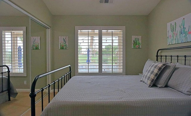 carpeted bedroom featuring a closet