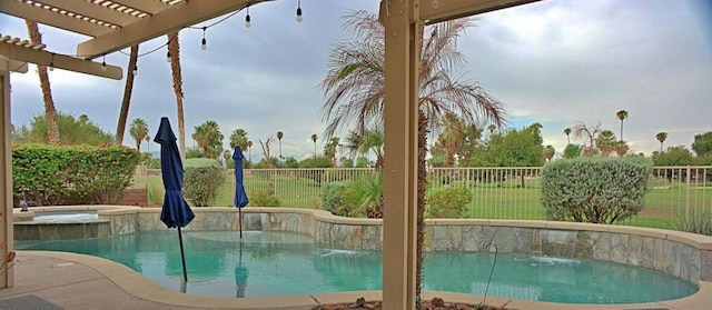 view of swimming pool with a pergola and an in ground hot tub