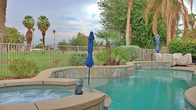 view of pool with an outdoor hot tub