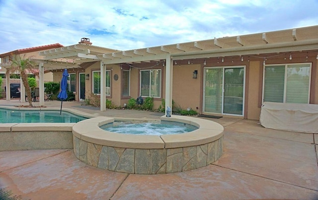 view of swimming pool featuring a pergola, an in ground hot tub, and a patio