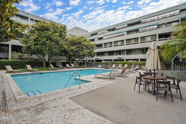 view of swimming pool with a patio