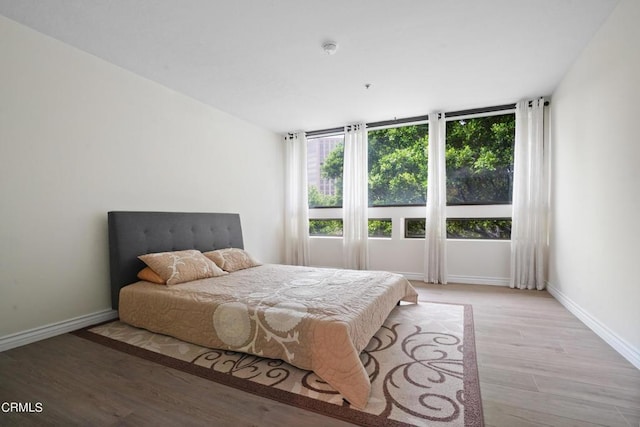 bedroom with light wood-type flooring