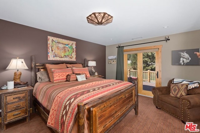 carpeted bedroom featuring access to outside