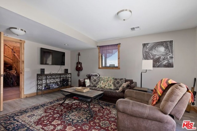 living room with light hardwood / wood-style flooring