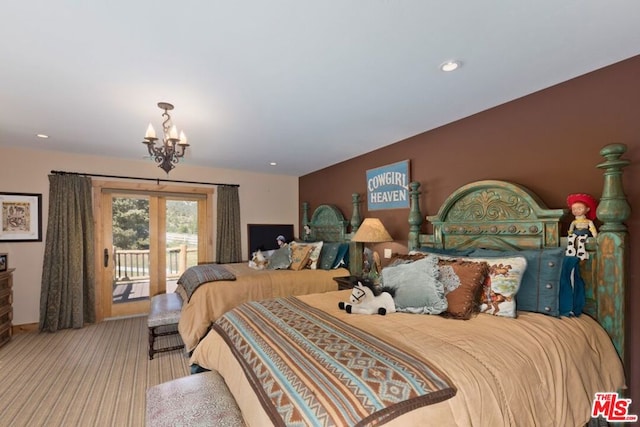 carpeted bedroom with access to exterior and a chandelier