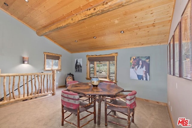 carpeted dining area with lofted ceiling with beams and wood ceiling