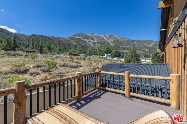 wooden terrace featuring a mountain view