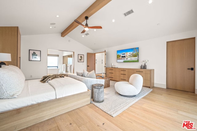 bedroom featuring vaulted ceiling with beams, ceiling fan, and light hardwood / wood-style flooring