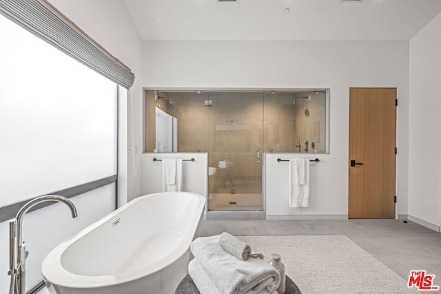 bathroom with shower with separate bathtub