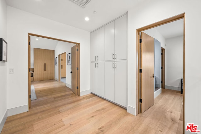 hallway featuring light wood-type flooring