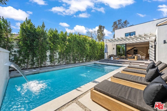 view of swimming pool with a patio, pool water feature, and a pergola