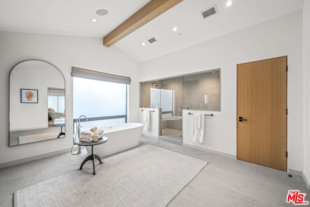 bathroom featuring vaulted ceiling with beams, tile patterned floors, and a tub