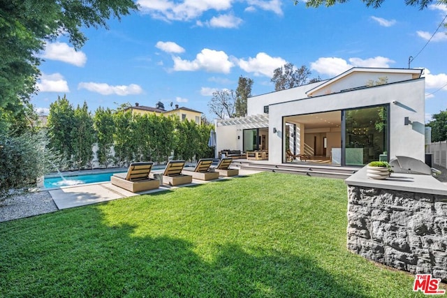 view of yard with a patio, pool water feature, and a pergola