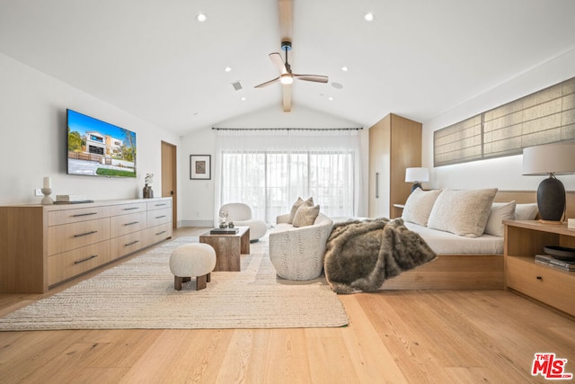 bedroom with lofted ceiling with beams, ceiling fan, and light hardwood / wood-style floors