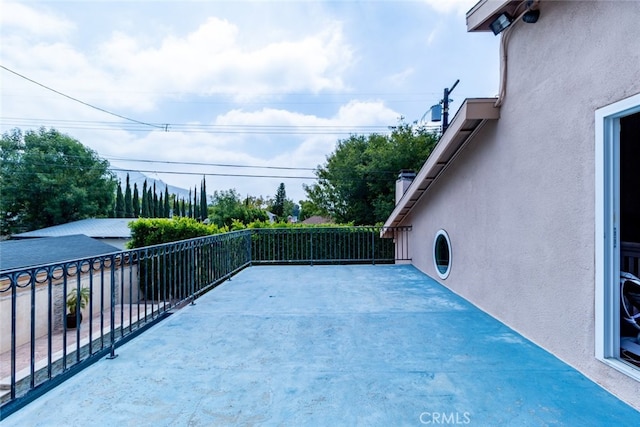 view of patio featuring a balcony