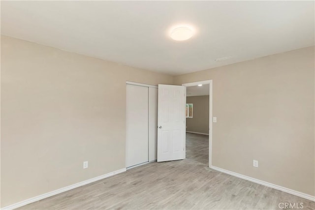 spare room with light wood-type flooring