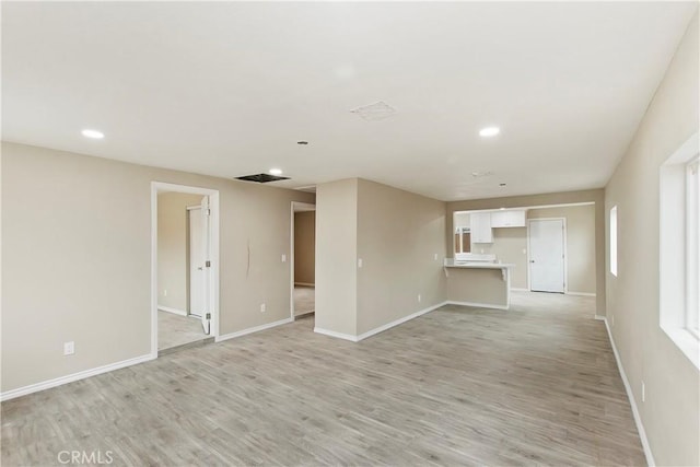 unfurnished living room with light hardwood / wood-style floors