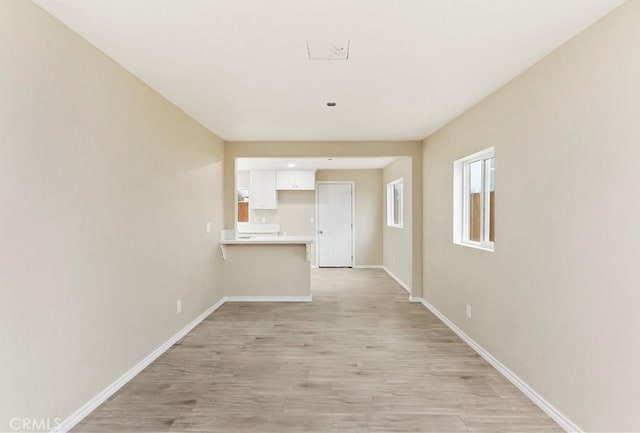 hallway featuring light hardwood / wood-style flooring