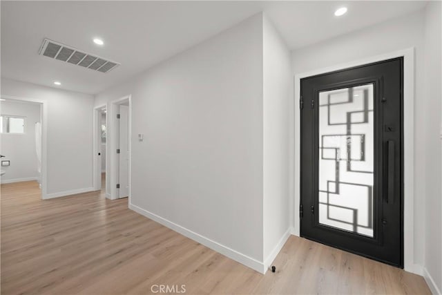 entrance foyer with light hardwood / wood-style floors