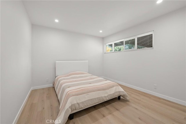 bedroom with light hardwood / wood-style flooring