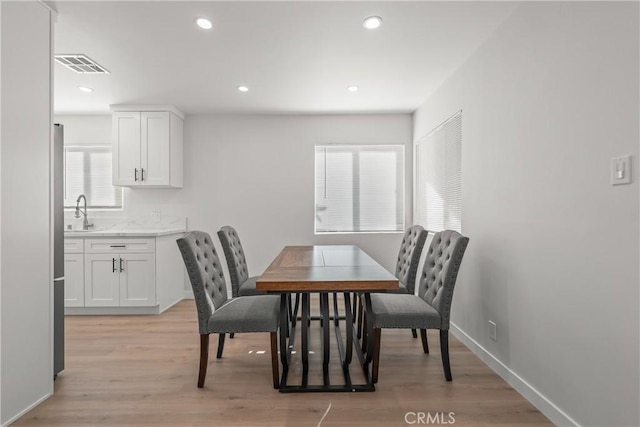 dining area featuring light hardwood / wood-style floors