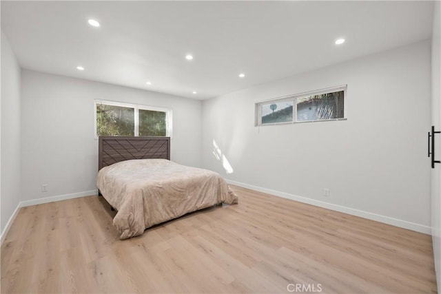 bedroom with light wood-type flooring