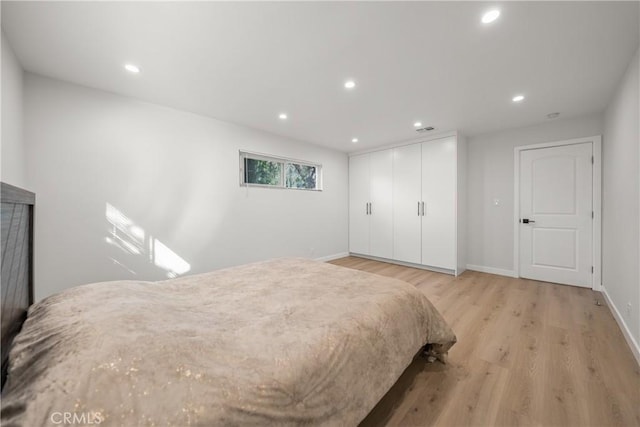 bedroom featuring light wood-type flooring