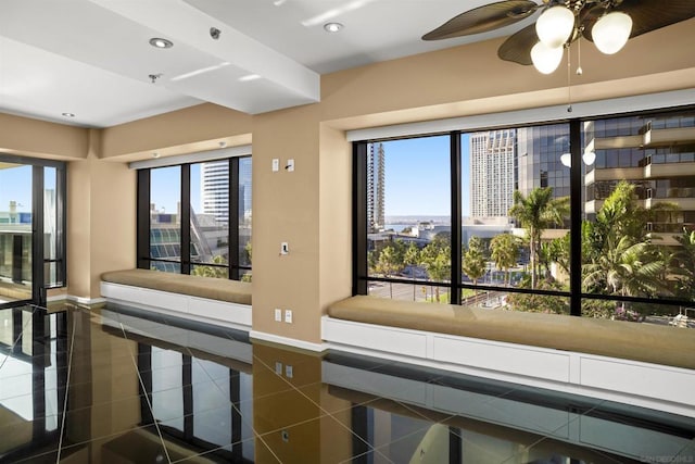 interior space with a healthy amount of sunlight and dark tile patterned flooring