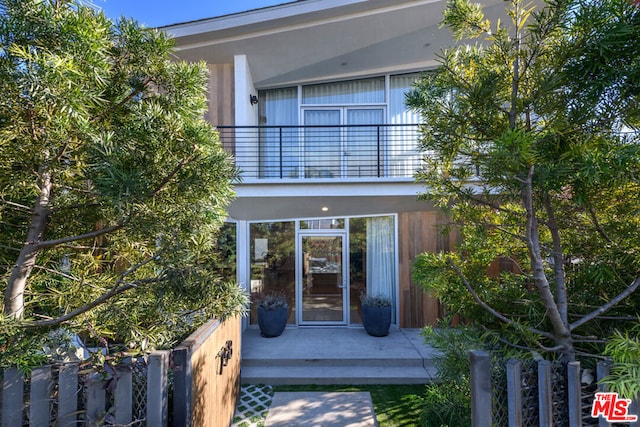 doorway to property with a balcony