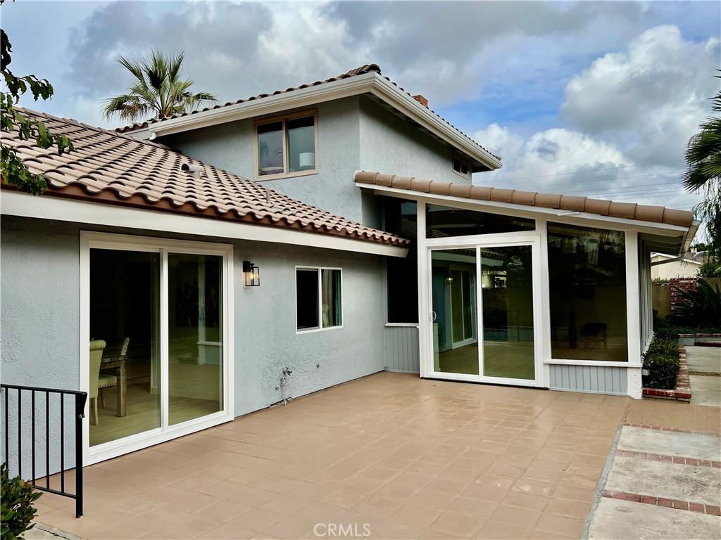 back of property featuring a patio area