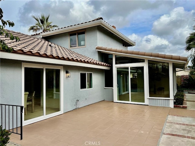 back of property featuring a patio area