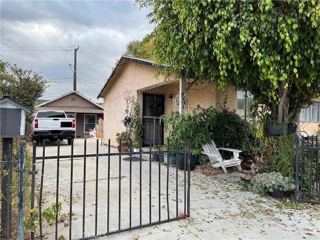 view of front of house with a garage and an outdoor structure