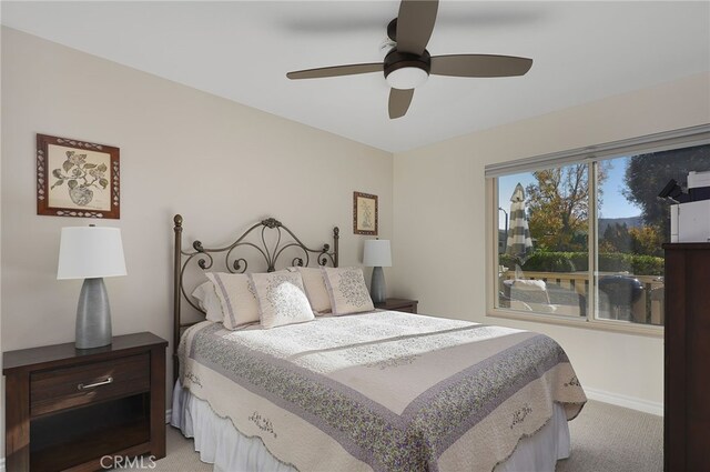 bedroom with light carpet and ceiling fan