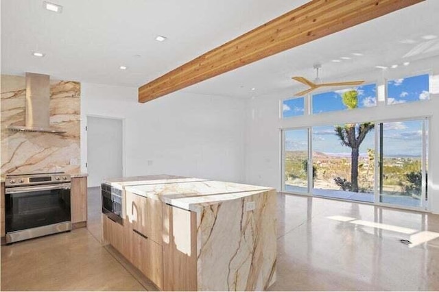 kitchen featuring stainless steel range, ventilation hood, light brown cabinets, a kitchen island, and beam ceiling