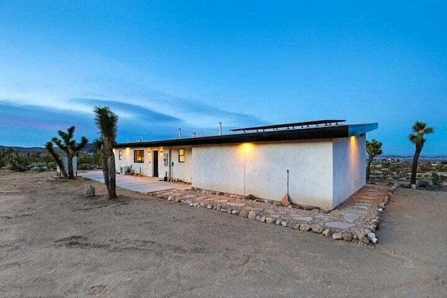 view of property exterior at dusk