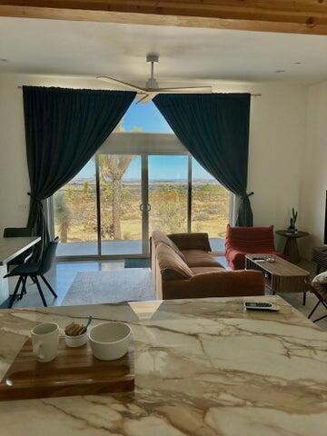 living area featuring ceiling fan